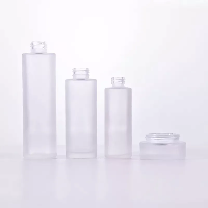 Cosmetic packaging 30ml 50ml 60ml 100ml 120ml 1oz 2oz 4oz flat shoulder clear frosted glass lotion bottle with bamboo pump cap