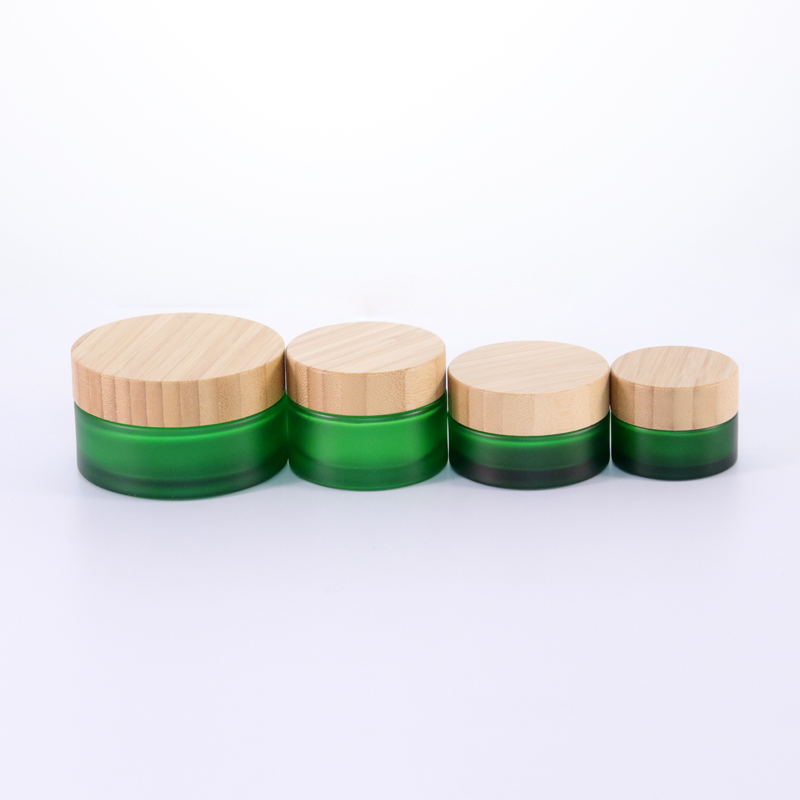 Hot sale Cosmetic Glass Jar Frosted Green 50g 100g Glass Cream Jar with Bamboo Lids