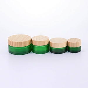 Hot sale Cosmetic Glass Jar Frosted Green 50g 100g Glass Cream Jar with Bamboo Lids