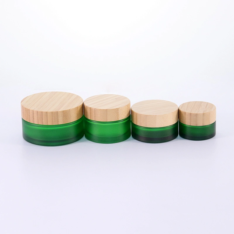 Hot sale Cosmetic Glass Jar Frosted Green 50g 100g Glass Cream Jar with Bamboo Lids