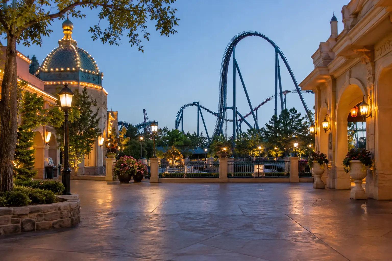 Amusement park walkway with roller coaster at dusk