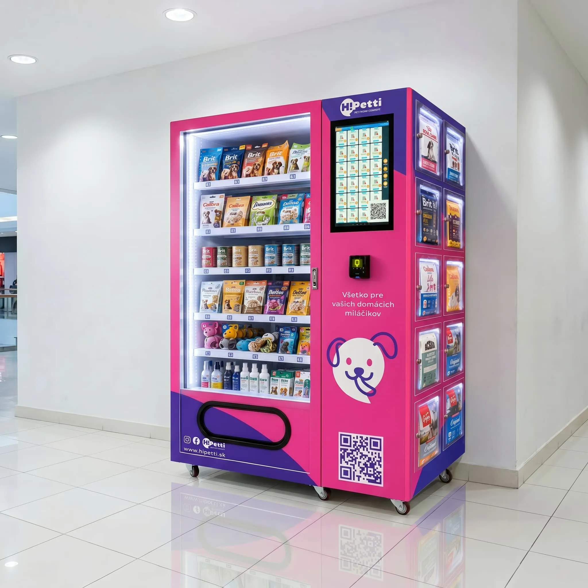 HiPetti pet supplies vending machine in pink and purple colors, side view, placed against a white wall in a modern shopping mall with bright lighting and glossy tiled floor.