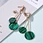 Stylish and unique vintage 18 carat gold plated and green large round geometric earrings
