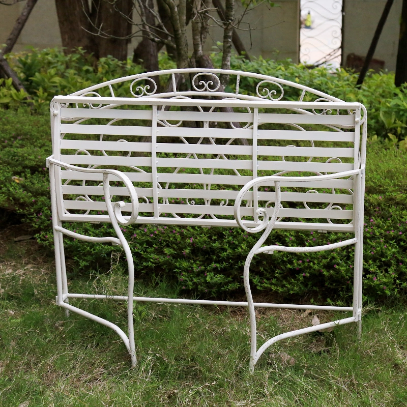 outdoor bench on grass under folding condition