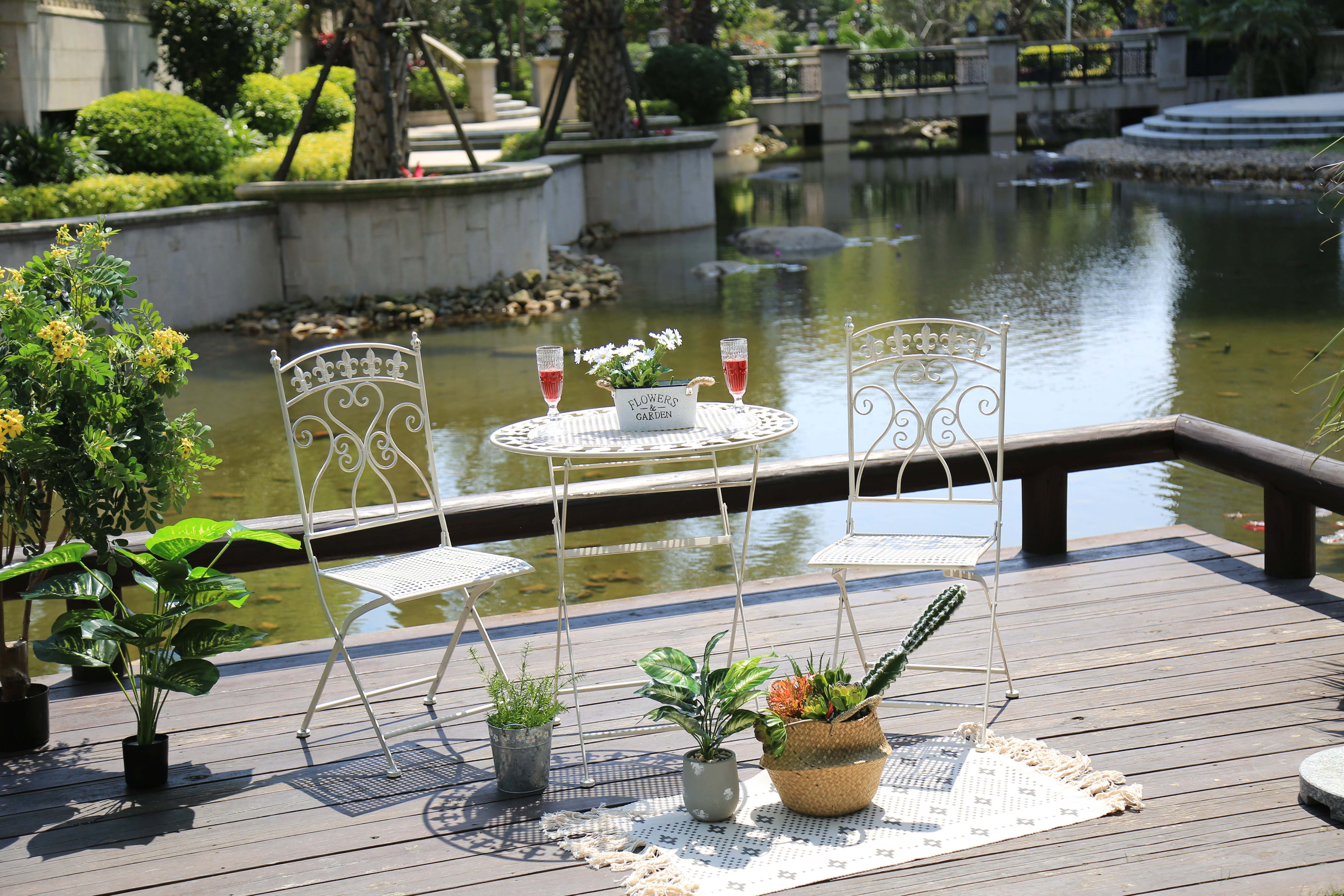 outdoor table and chairs on patio with sunlight