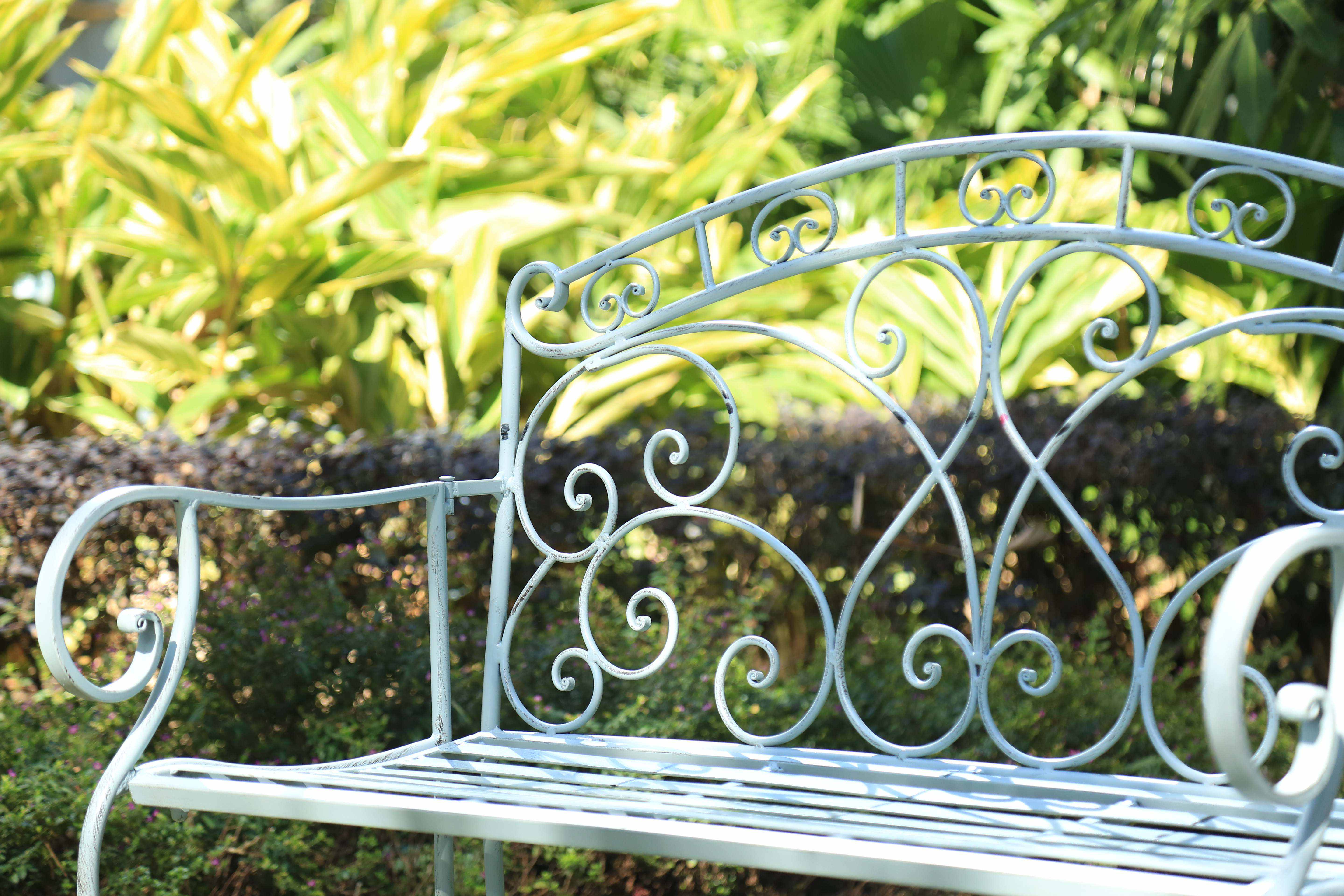 durable iron bench in green finish under sunlight