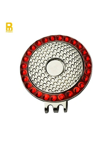 The ball marker hat clip is a convenient and stylish accessory for golfers. It attaches easily to the brim of a hat or visor, providing quick access to a ball marker.