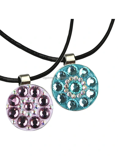 The golf ball marker necklace is a stylish and functional accessory for golfers. This necklace features a detachable ball marker pendant that can be easily removed and used on the green.