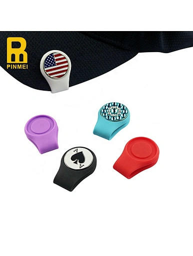 The magnetic clip golf ball marker is a versatile accessory for golfers. It features a strong magnet that securely holds the ball marker in place, making it easily accessible on the golfer's hat or clothing.