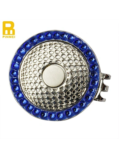 The magnetic golf ball marker hat clip is a practical accessory for golfers. It securely attaches to the brim of a hat using a magnetic mechanism, providing a convenient and easily accessible spot to hold a ball marker.