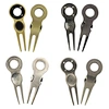 The ball marker divot repair tool is a small, handy device used in golf to mark the position of a ball and repair divots on the green. It is made of durable metal and has a sharp prong on one end for fixing the turf.
