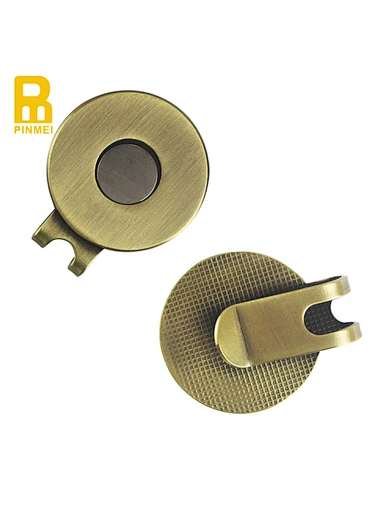 A golf hat clip is a convenient accessory that attaches to the brim of your hat. It securely holds your ball marker, keeping it easily accessible during your game.