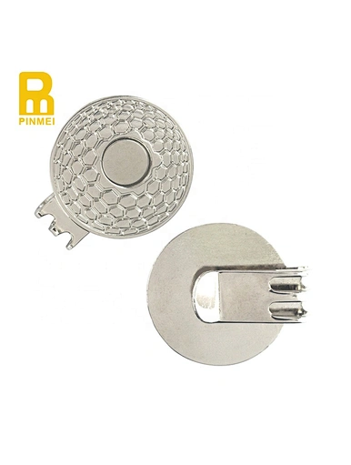 A golf ball marker hat clip is a versatile accessory that attaches to the brim of your hat. It securely holds your ball marker, allowing for easy access and preventing loss.