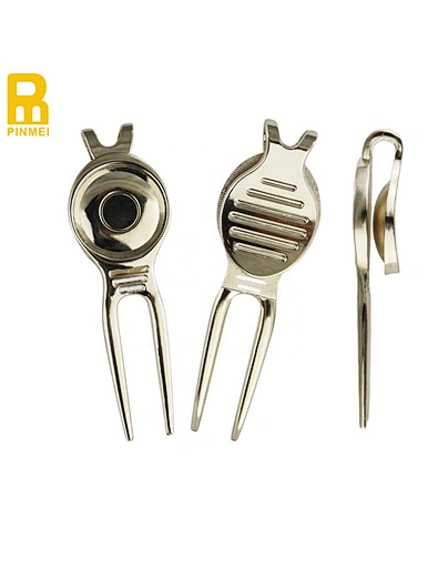 A divot tool is a small handheld device used to repair divots or marks on the golf course caused by golf balls landing on the ground.