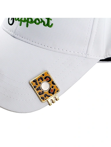 The golf hat clip and ball marker is a convenient accessory that attaches to your hat or visor. It features a removable ball marker that can be easily accessed and used during your game. A practical and stylish addition to your golfing gear.