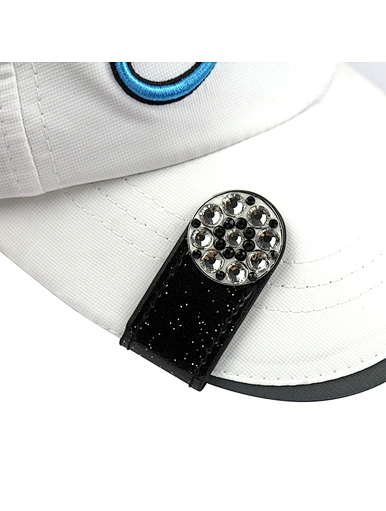The golf ball marker hat clip is a versatile and functional accessory for golfers. It features a clip that securely attaches to a hat or visor, keeping the ball marker easily accessible.