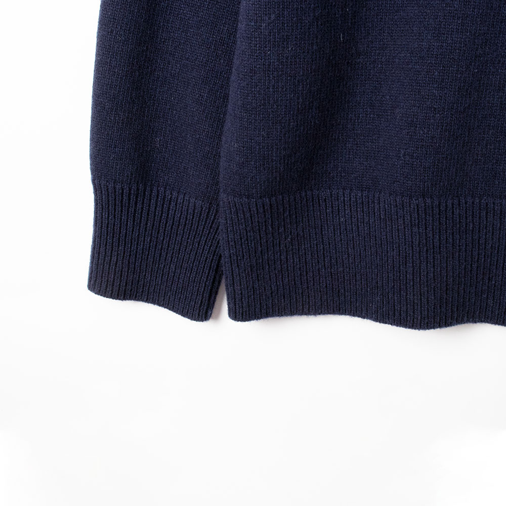 minimalist dark-toned everyday v-neck sweater rib hem detail