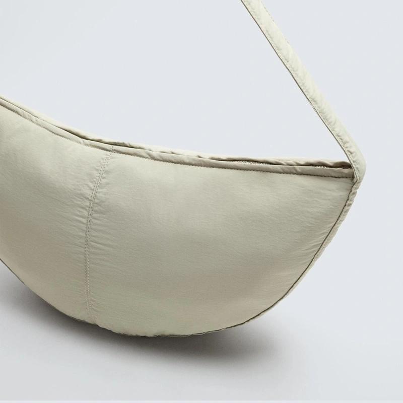 beige crossbody bag strap detail
