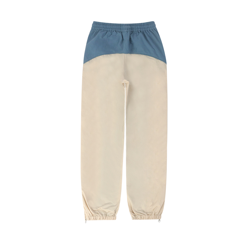 light blue and beige color block nylon track pants back view