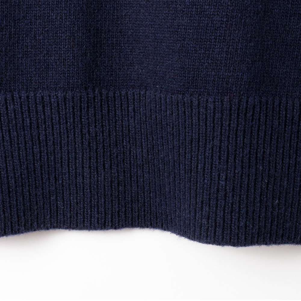 navy blue oversized v-neck knit sweater fabric detail