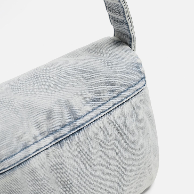denim messenger bag strap detail
