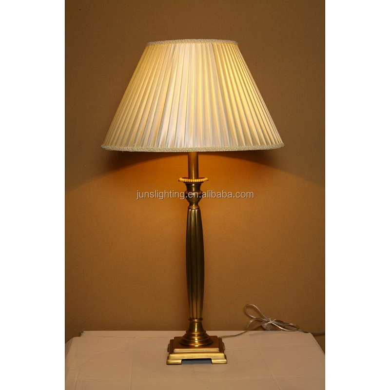 Traditional brass table lamp with fabric shade for hotel lighting