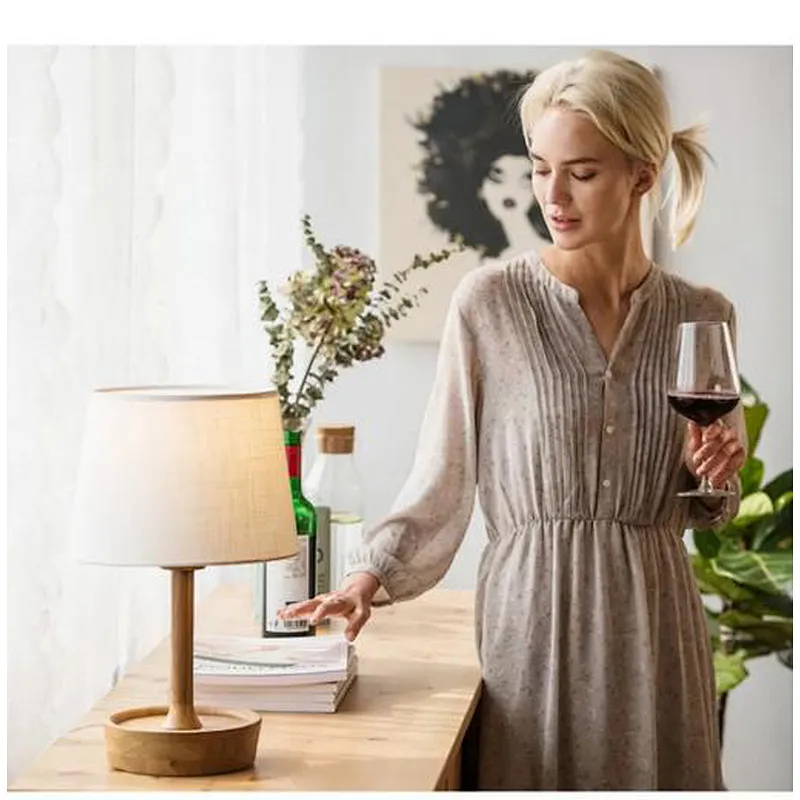Adjustable wooden table lamp with parchment shade