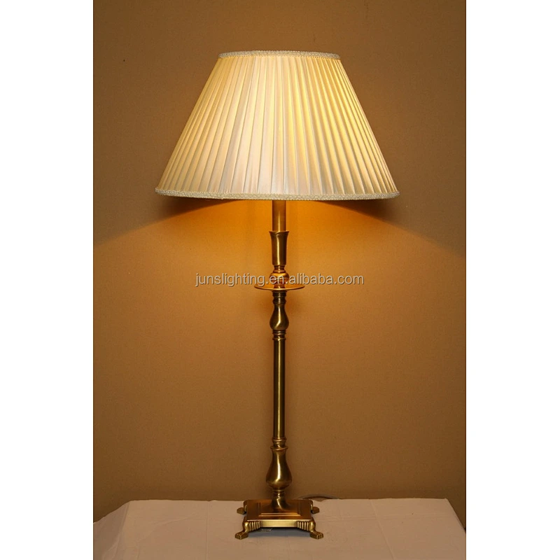 Traditional brass table lamp with fabric shade for hotel lighting