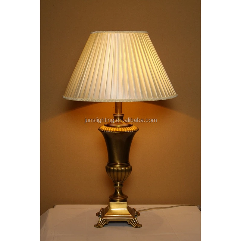 Traditional brass table lamp with fabric shade for hotel lighting