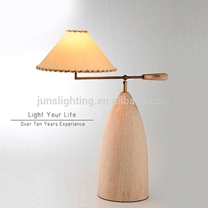 Adjustable wooden table lamp with parchment shade