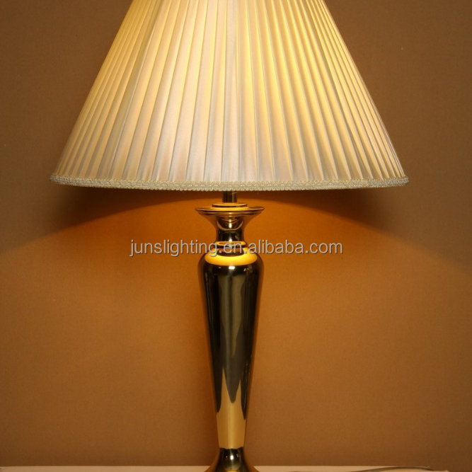 Traditional brass table lamp with fabric shade for hotel lighting