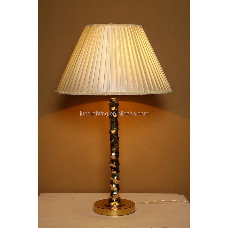 Traditional brass table lamp with fabric shade for hotel lighting