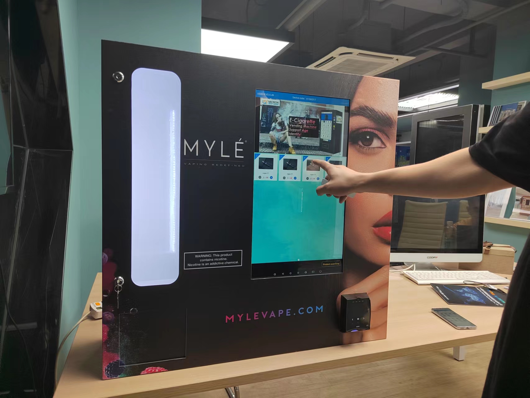E-cigarette vending machine with age judge feature