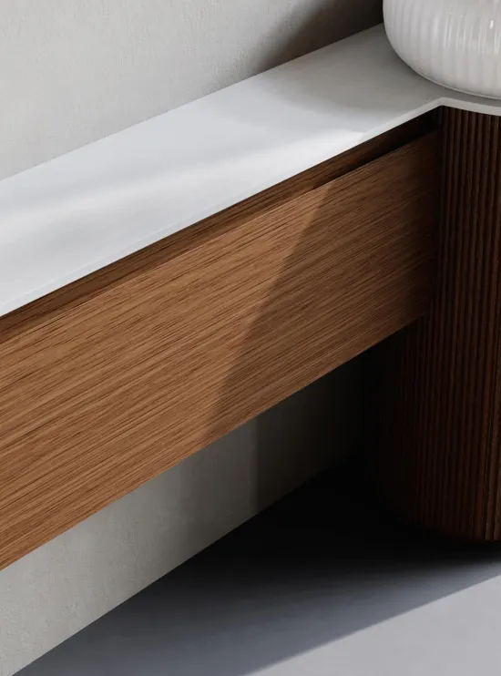 freestanding bathroom vanity combining horizontal storage cabinet with cylindrical vertical storage