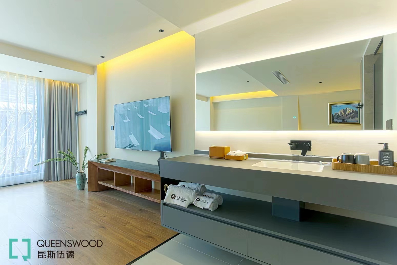 The design features a sleek glass shower enclosure, creating a luxurious bathing experience, accompanied by a stylish shower set that elevates both practicality and aesthetics. The use of high-quality sanitary ware ensures comfort and durability, providing guests with an indulgent retreat.