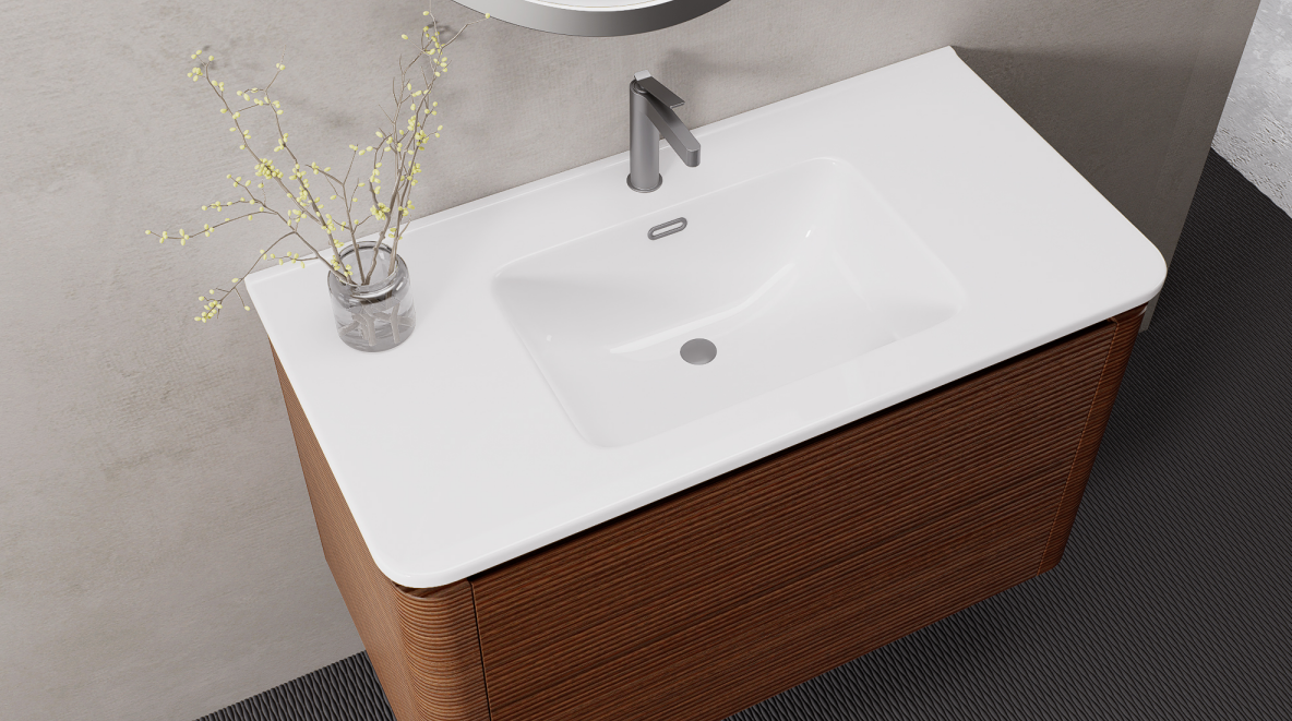 An integrated ceramic basin offers a practical surface for everyday use and is easy to combine with a clean modern vanity layout.