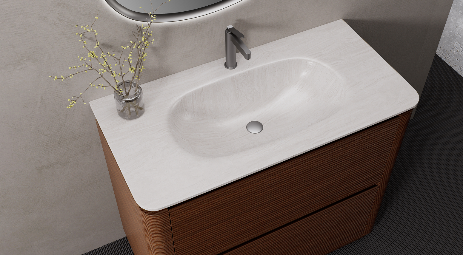 A solid surface basin provides a more seamless contemporary appearance and works naturally with the smooth curved cabinet profile.