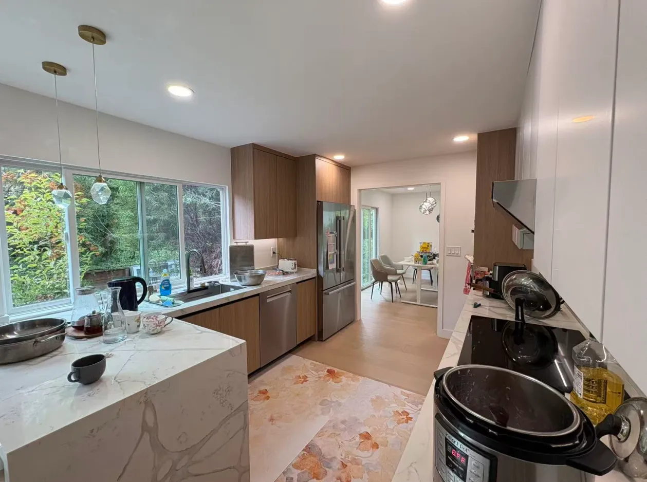 added a touch of elegance and brightness to the plywood kitchen cabinets, reflecting light beautifully and creating an inviting atmosphere for cooking and entertaining
