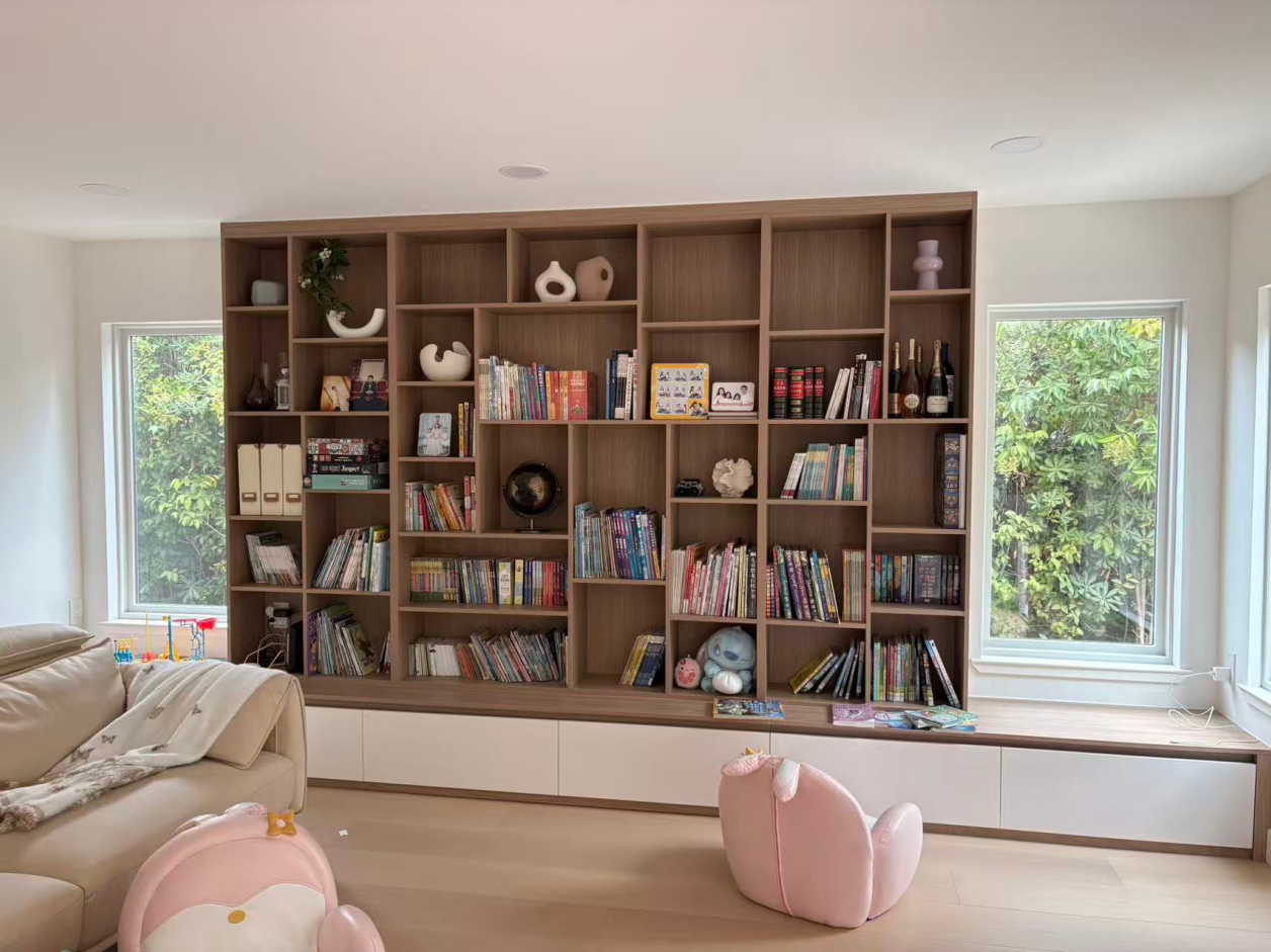 The combination of the wood bookcase's earthy tones with the modern white drawer fronts offers a striking visual contrast, making it a focal point in any room.