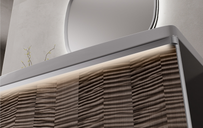 The warm glow hidden within the aluminum drawer handles blends perfectly with the integrated frame