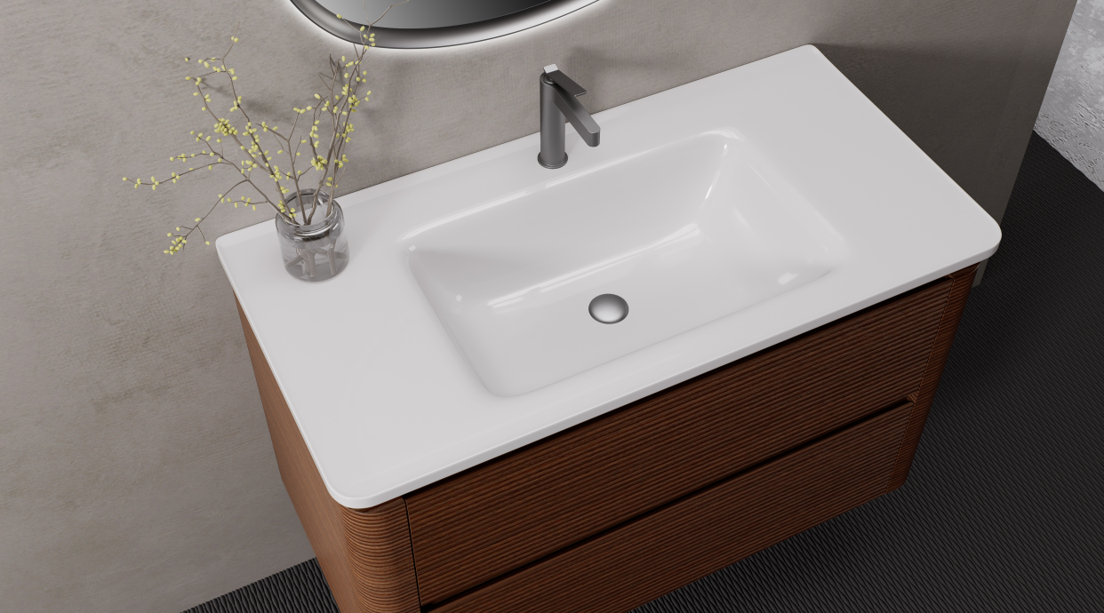 A ceramic integrated basin provides a familiar, easy-to-clean surface and works well for residential and hospitality applications.