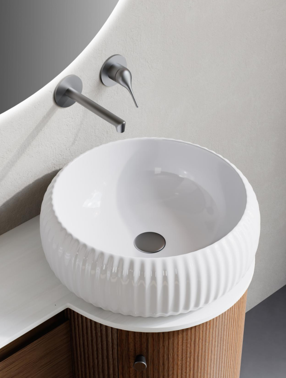 A countertop basin emphasizes the furniture-like character of the vanity