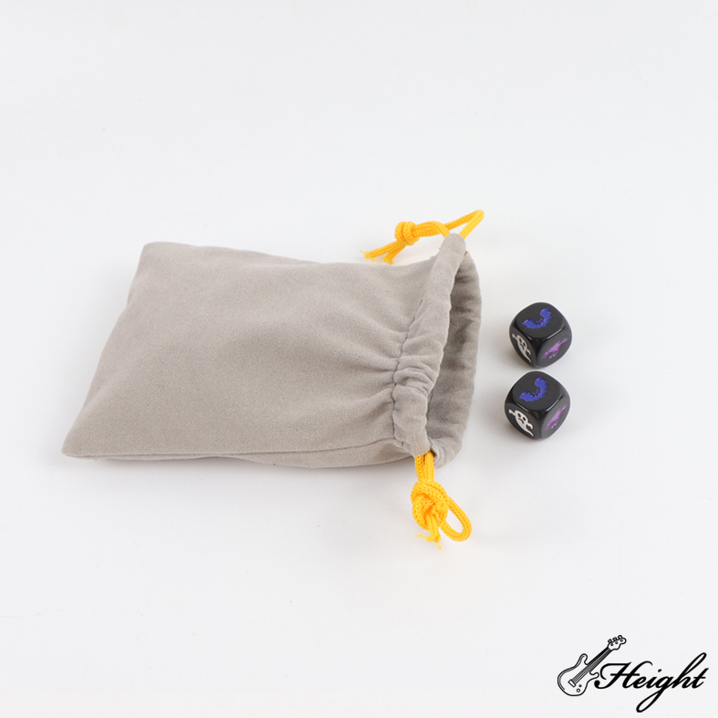 1 small grey drawstring bag with 2 dices