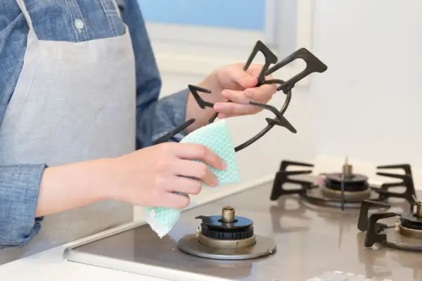 wiping down stove grate