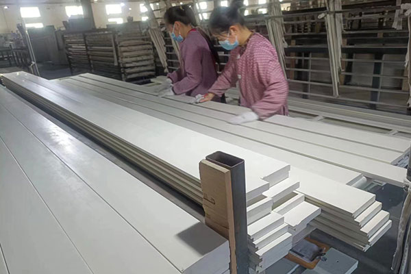 Professional QC inspects the surface of shutter components