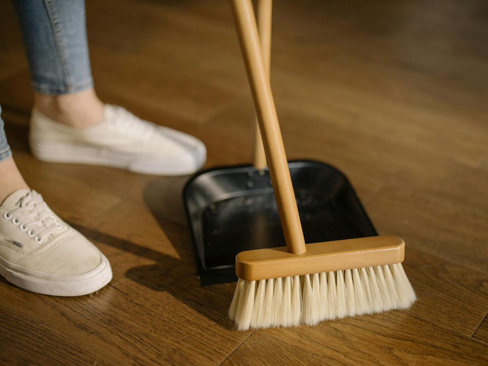 Broom on the wooden floor.