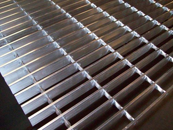 swage-locked grating