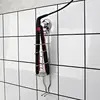 Suction cup hair straightener holder