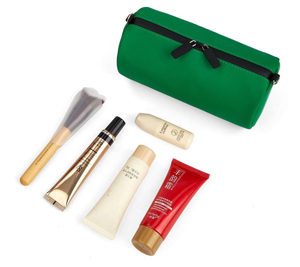 green leather bag and pencil case