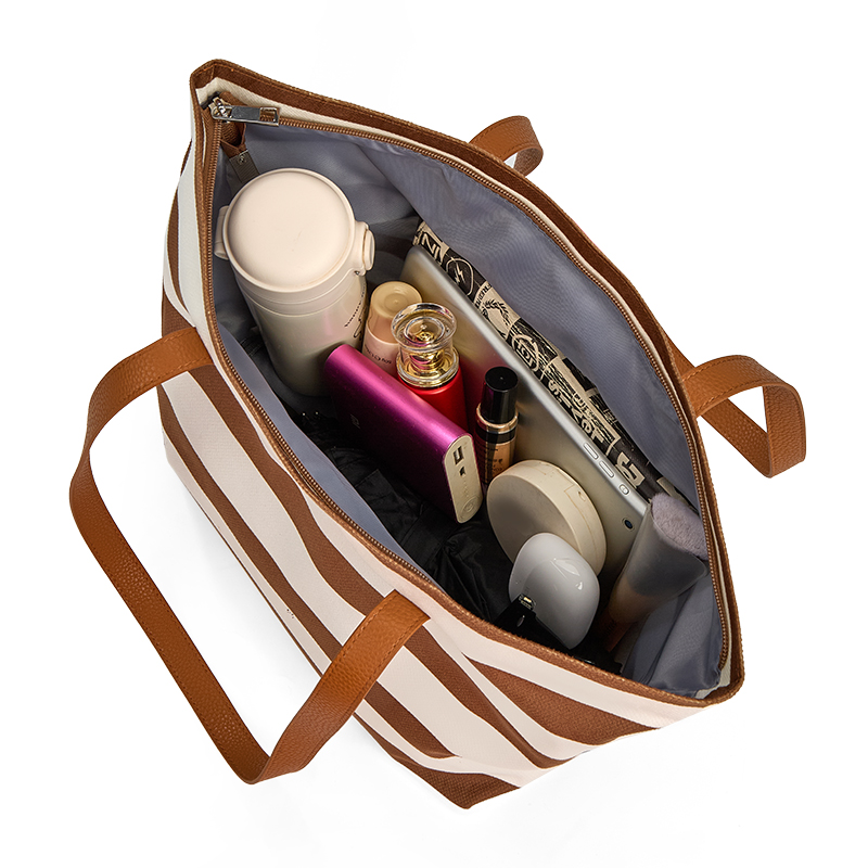 The interior filled with various items of this bag in tote,large capacity.